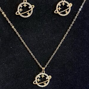 Saturn planet necklace and earrings set on a gold tone chain 17”